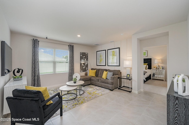 living area featuring recessed lighting, light tile patterned floors, baseboards, and visible vents