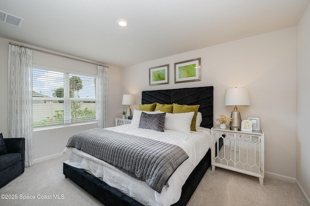 bedroom featuring visible vents, carpet floors, and baseboards