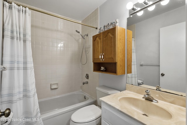 full bathroom featuring vanity, toilet, and shower / bathtub combination with curtain