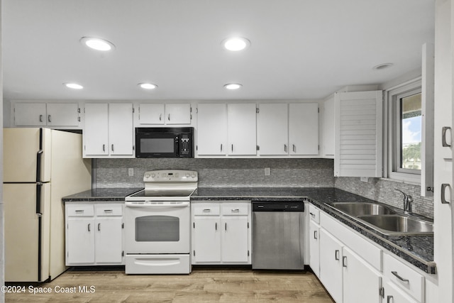 kitchen featuring white cabinetry, light wood-type flooring, white appliances, and sink