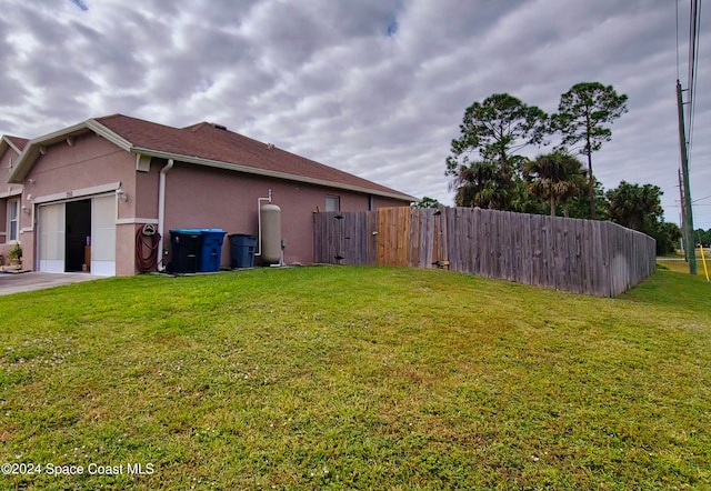 view of side of home featuring a yard