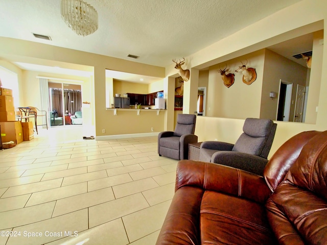 tiled living room with a textured ceiling