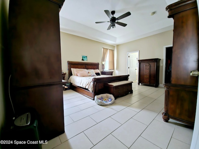 bedroom featuring ceiling fan and light tile patterned floors