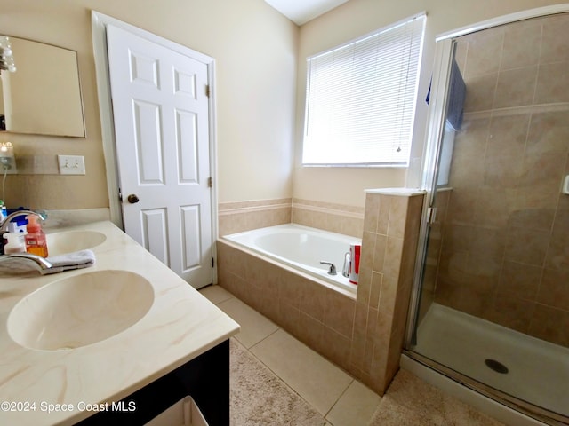 bathroom featuring tile patterned flooring, vanity, and plus walk in shower