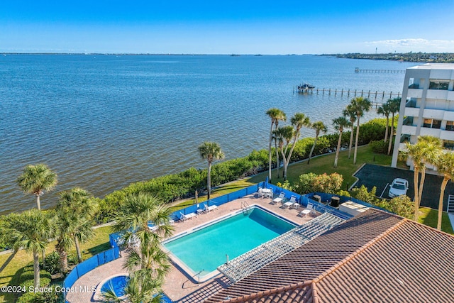 exterior space with a patio area and a water view