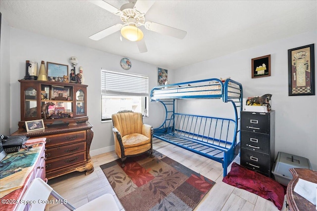 bedroom featuring light hardwood / wood-style flooring and ceiling fan