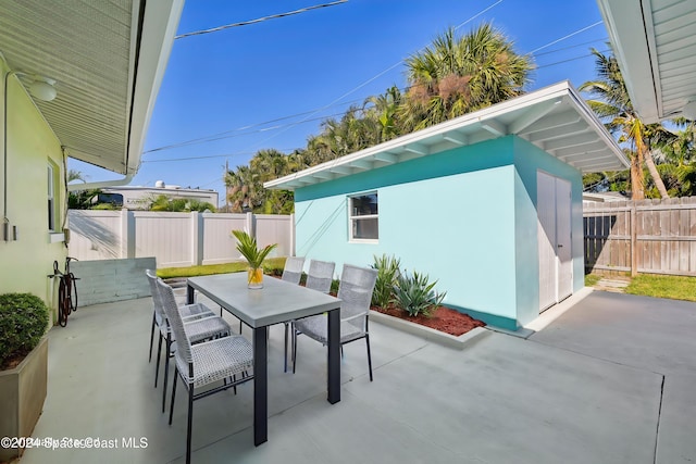 view of patio / terrace with a storage shed