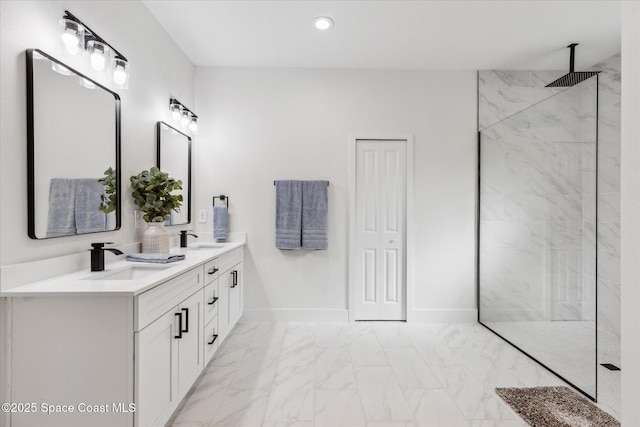 bathroom with vanity and a tile shower