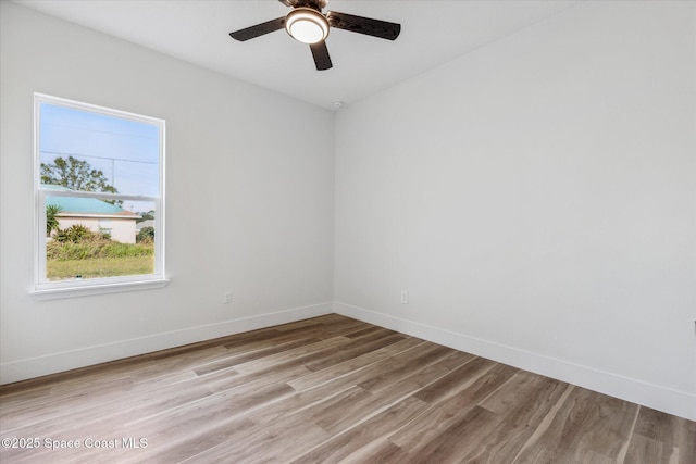 spare room featuring ceiling fan and light wood-type flooring