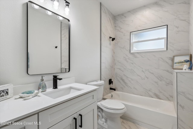 full bathroom featuring toilet, tiled shower / bath combo, and vanity