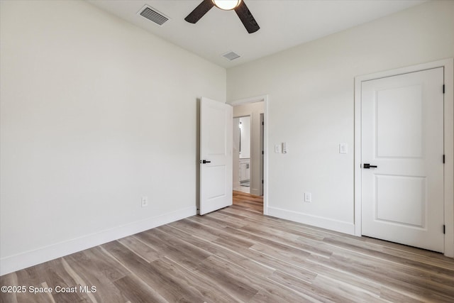 unfurnished bedroom featuring ceiling fan and light hardwood / wood-style flooring