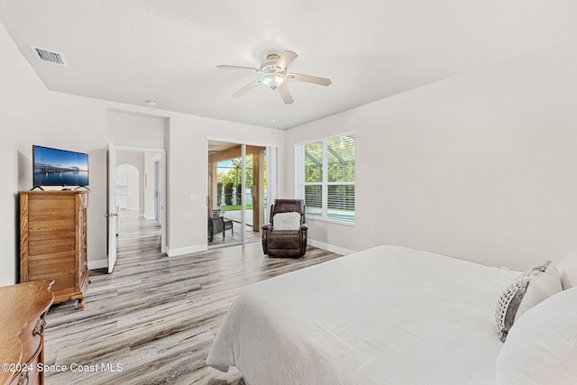 bedroom featuring light wood-type flooring, access to outside, and ceiling fan