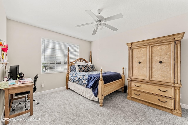 bedroom with light carpet and ceiling fan