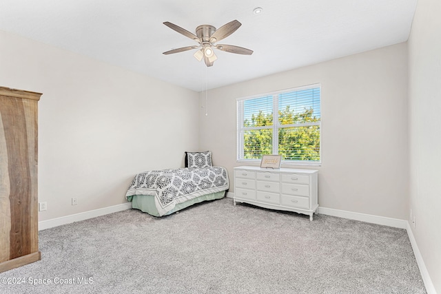 carpeted bedroom featuring ceiling fan