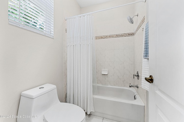 bathroom featuring shower / bathtub combination with curtain and toilet