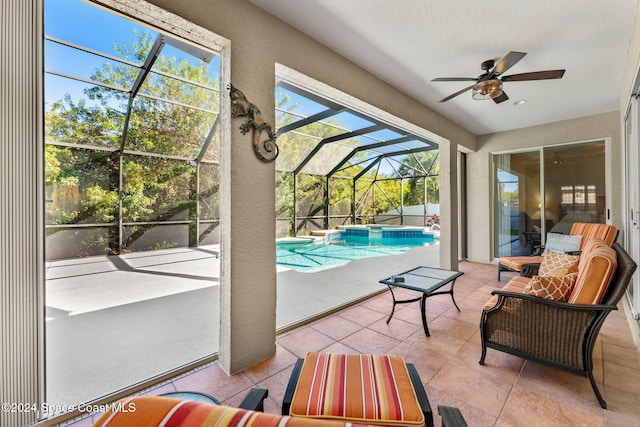 sunroom featuring ceiling fan and a pool