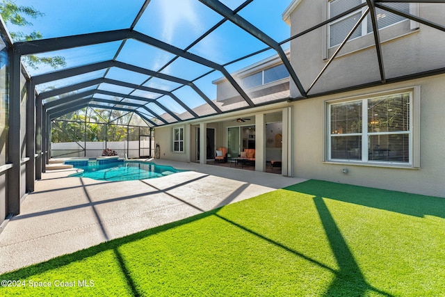 view of pool featuring ceiling fan, a lanai, a patio, and a hot tub