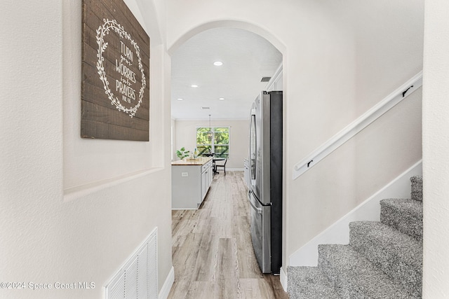 hallway with light wood-type flooring