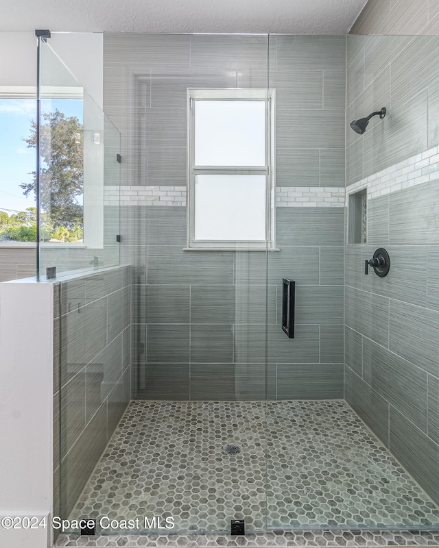 bathroom featuring an enclosed shower