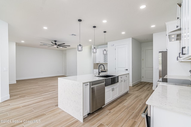 kitchen with light stone countertops, stainless steel dishwasher, pendant lighting, a kitchen island with sink, and white cabinets