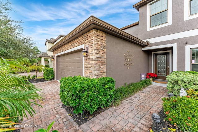 view of property exterior with a garage