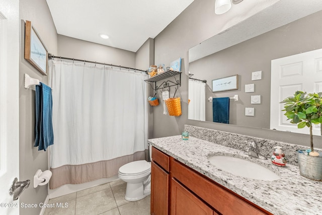 full bathroom with tile patterned flooring, vanity, toilet, and shower / tub combo