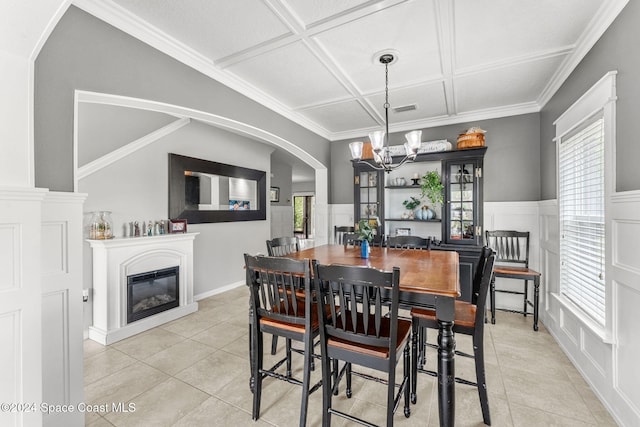 dining room with crown molding, light tile patterned flooring, a chandelier, and coffered ceiling