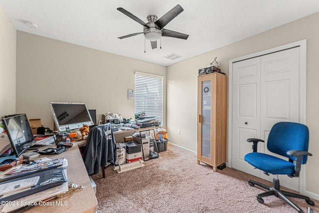 office space with carpet flooring and ceiling fan