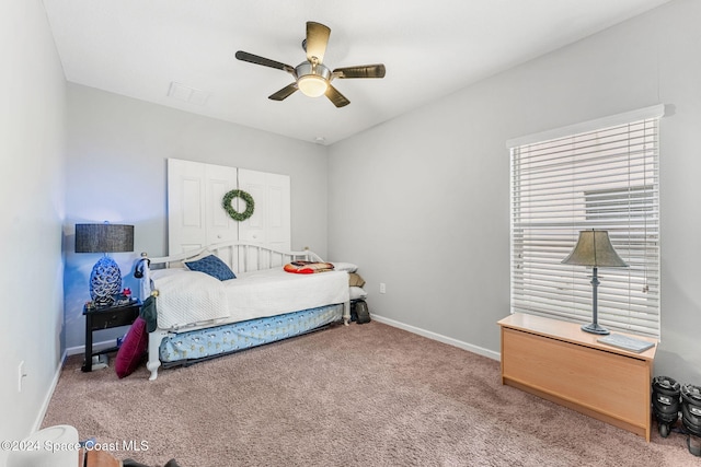 carpeted bedroom featuring ceiling fan