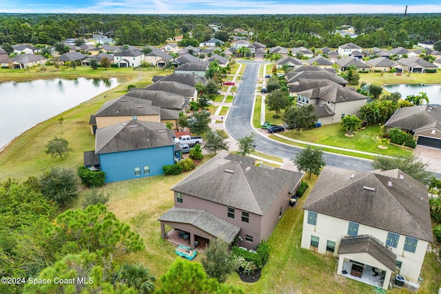 drone / aerial view with a water view