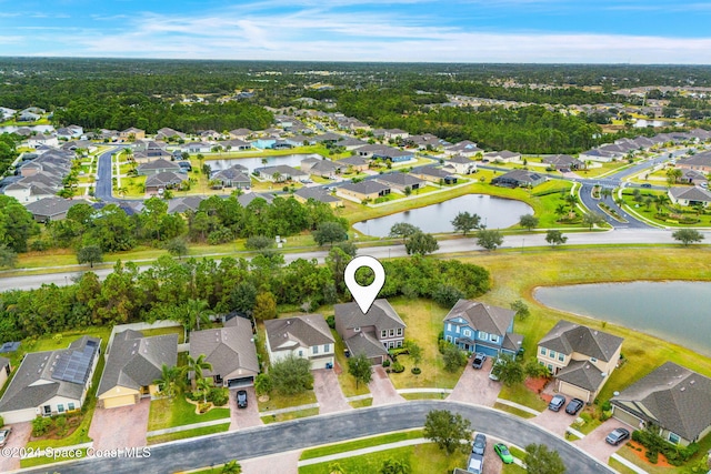 drone / aerial view with a water view