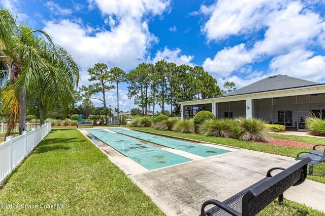 view of pool featuring a yard