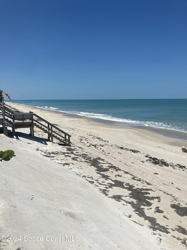 view of water feature with a beach view