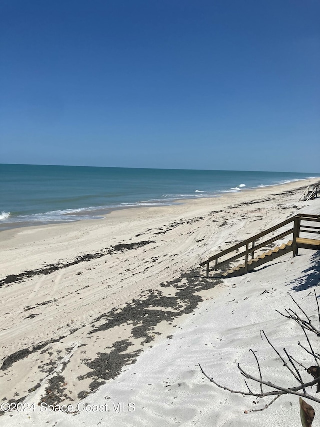 view of water feature with a beach view