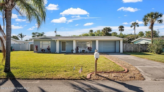 ranch-style home with a garage and a front lawn