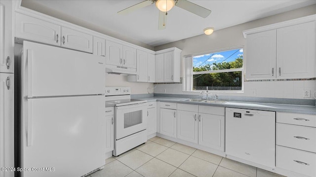 kitchen with white cabinets, white appliances, and sink