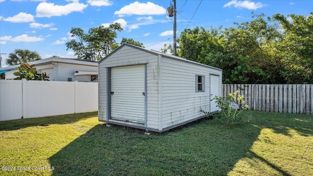 view of outdoor structure with a yard