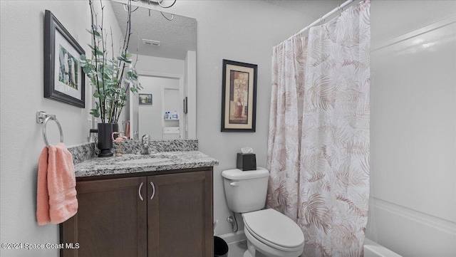 full bathroom featuring a textured ceiling, vanity, toilet, and shower / bath combination with curtain