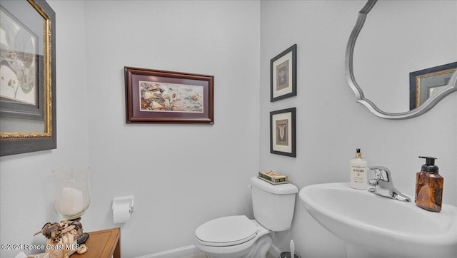 bathroom with toilet and sink