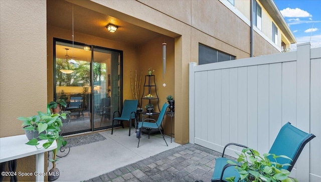 property entrance featuring a patio