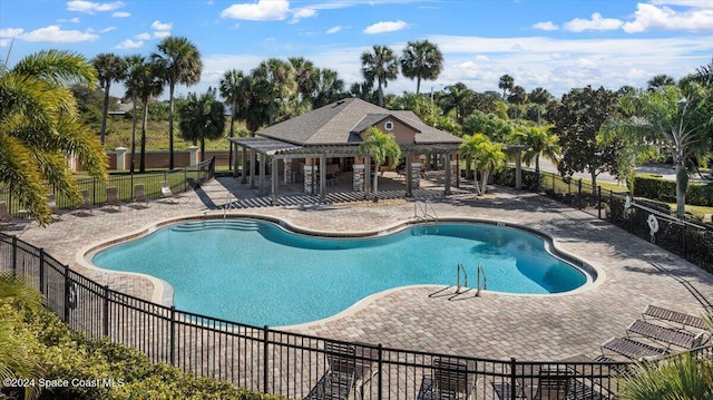 view of swimming pool featuring a patio area