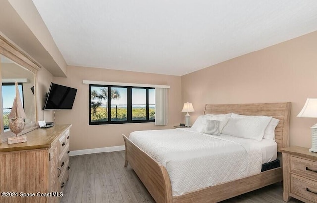 bedroom with light wood-type flooring