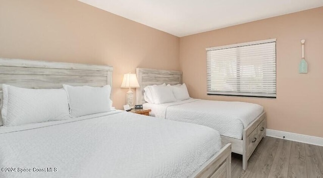 bedroom featuring light wood-type flooring