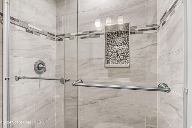 bathroom featuring an enclosed shower