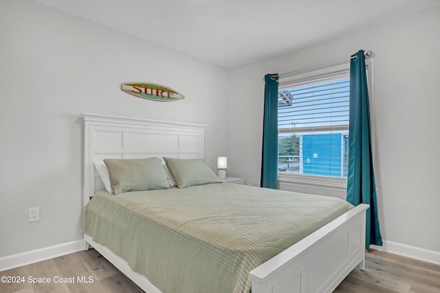 bedroom with light wood-type flooring