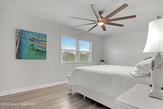 bedroom featuring ceiling fan and wood-type flooring