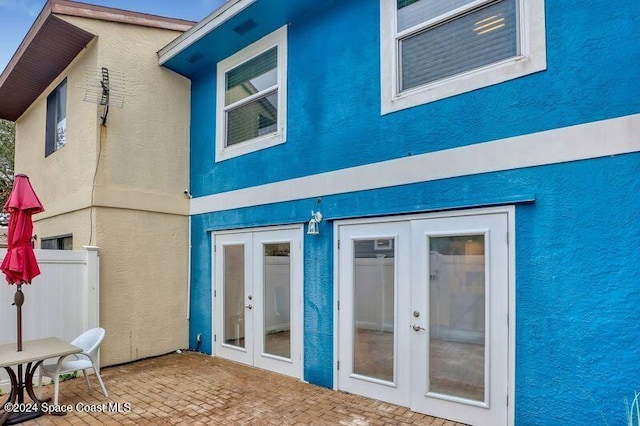 back of house with french doors and a patio