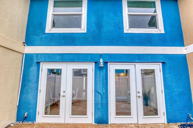 entrance to property featuring french doors