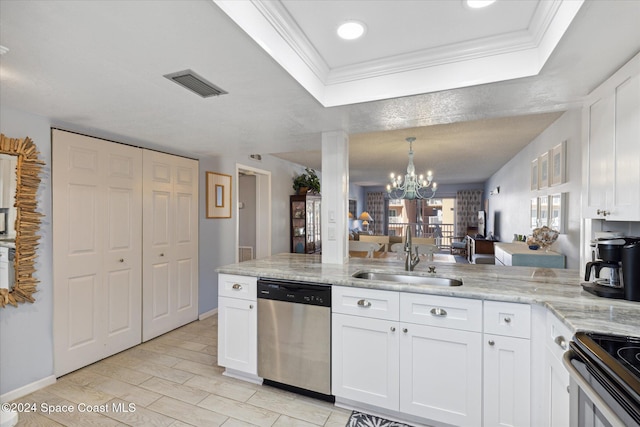 kitchen featuring light wood-type flooring, stainless steel appliances, sink, an inviting chandelier, and white cabinetry