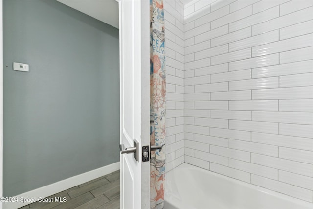 bathroom featuring shower / bath combination with curtain